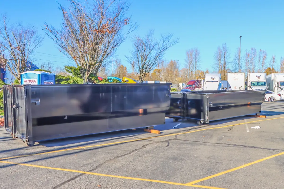 Professional dumpster rental service with roll-off container on residential driveway in Haddon Heights